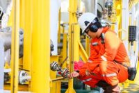 operator recording operation of oil and gas process