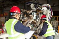 Factory workers with robots