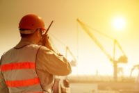 Safety worker wearing PPE in the heat