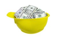 Hard hat filled with money